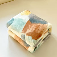 PRISMACLOUD – Couverture géométrique aquarelle pour un confort supérieur