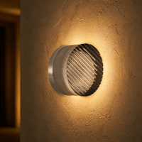 FORMELLE – Applique da parete scolpita per un’illuminazione d’atmosfera elegante